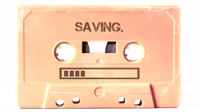 The text Saving and a progress bar appearing on the surface of a vintage cassette tape from the 1980s era (obsolete music technology). Color: cream, sand. Isolated on white background.
