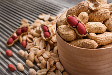 fresh peanuts on a wooden rustic background