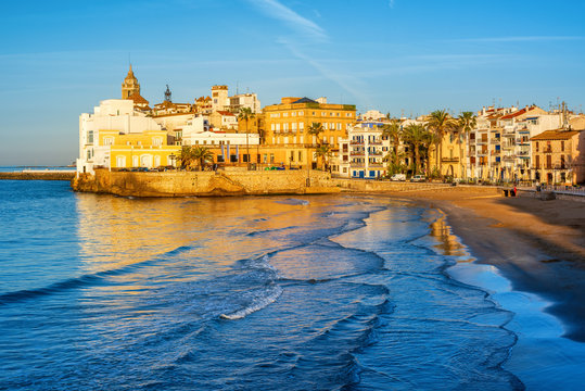 Sand beach and historical Old Town in mediterranean resort Sitges, Spain