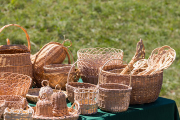 Many different wicker baskets for sale on market