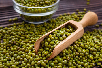 fresh Mung beans on a rustic wooden background