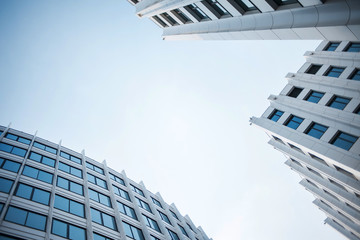 facade of white buildings in the business quarter. Not fully glass facades