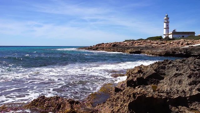 Beautiful coast view with lighthouse at Cape de Ses Salines on Mallorca island, Spain Mediterranean Sea