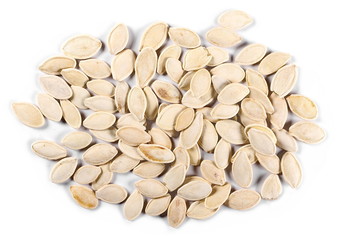 pile pumpkin seeds isolated on white background, top view