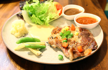 Black pepper pork steak and Vegetable Salad .