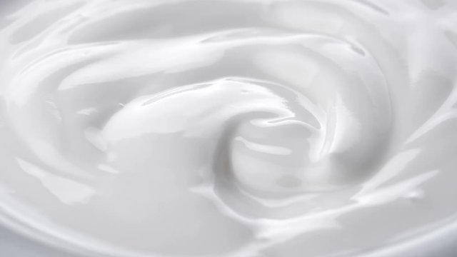 Closeup shot of mixing yogurt, Rotating
