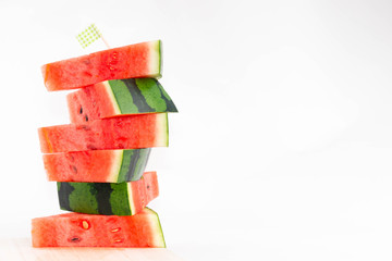 Stacked slices of fresh red watermelon isolated.