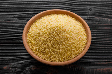 fresh couscous on a wooden rustic background