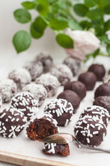 Vegan sweets made from prunes, dates, almonds, sesame, nuts, hazelnuts, nuts, chocolate, goji berries