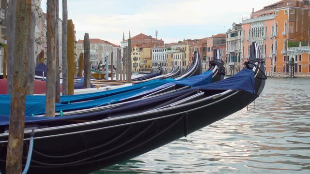 Moored gondolas on The Grand Canal in Venice close-up, Italy