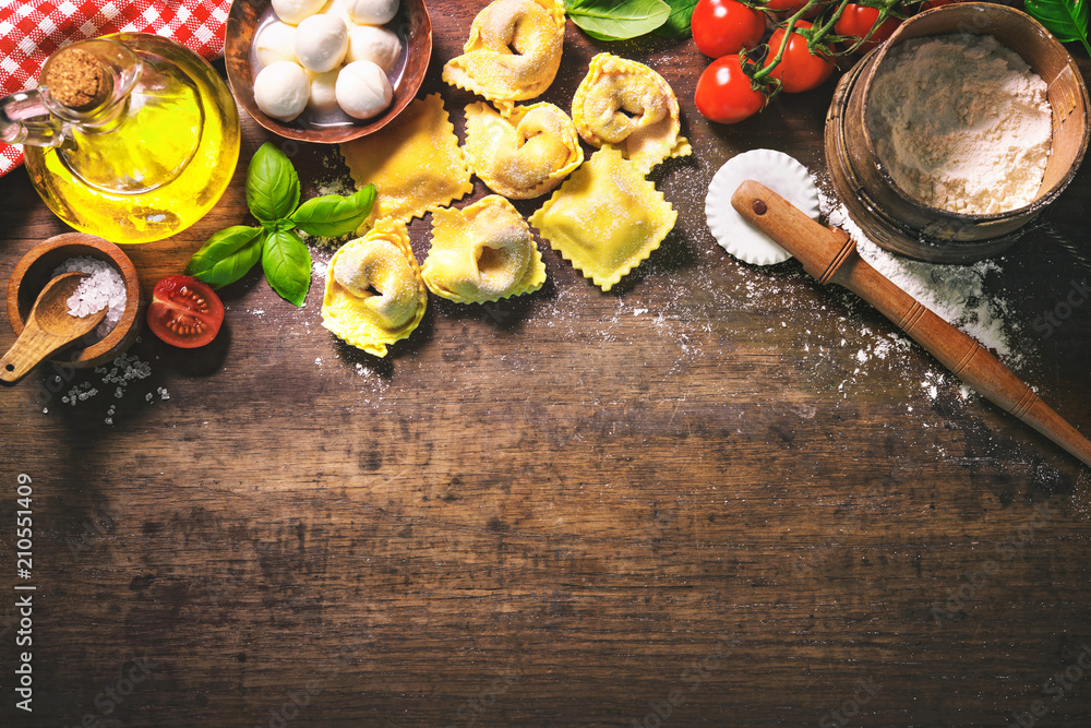 Wall mural Top view on homemade pasta ravioli on old wooden table