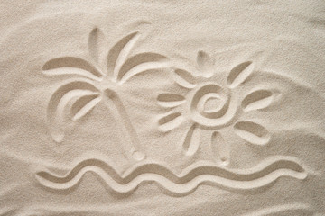 Sun, palm and sea hand-drawn on the beach sand