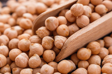 uncooked chickpeas on a wooden rustic background
