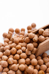 uncooked chickpeas on a white acrylic background