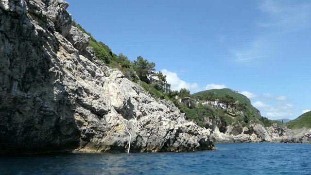 driving with a boat from Paleokastritsa to Liapades beach at Corfu Island (Greece)