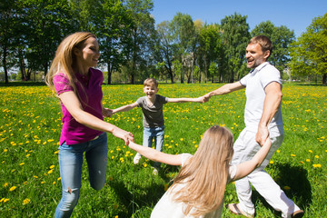 Family dancing in park