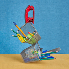 Stationery floats in air under conditions of zero gravity.