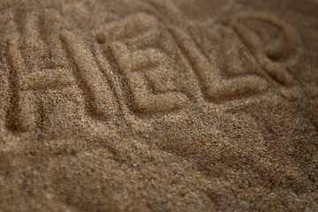 Cry for Help written in Sand