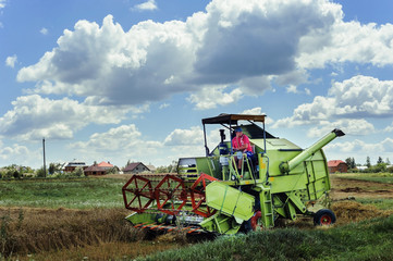 The farmer on the combine harveste.