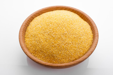 raw Italian corn porridge polenta on a white background