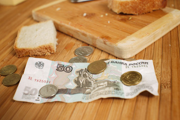 Pension reform in Russia, a piece of bread, small change, rubles, food