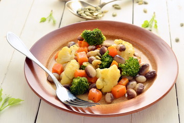 Broccoli, cauliflower, squash and beans with pumpkin seeds