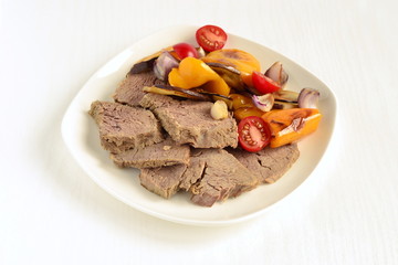 Boiled beef with baked vegetables