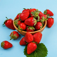 juicy fresh strawberry on a delicately blue background
