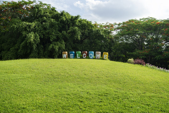 Welcome image of green garden background in the park