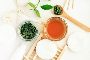 Cosmetic inredients with green tea extract for skincare. Homemade facial refreshing herbal tonic....