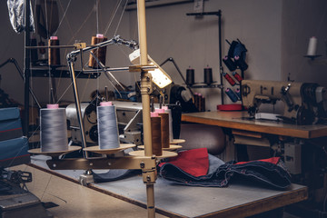 Picture of a tailor's desktop at the sewing workshop.