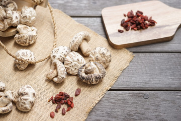 dried mushroom and goji berries. Soft focus of Shiitake mushroom. Normally use to make clear soup.