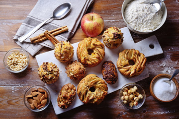 Homemade sweets, apple donuts, muffins, pastries and ingredients. Top view