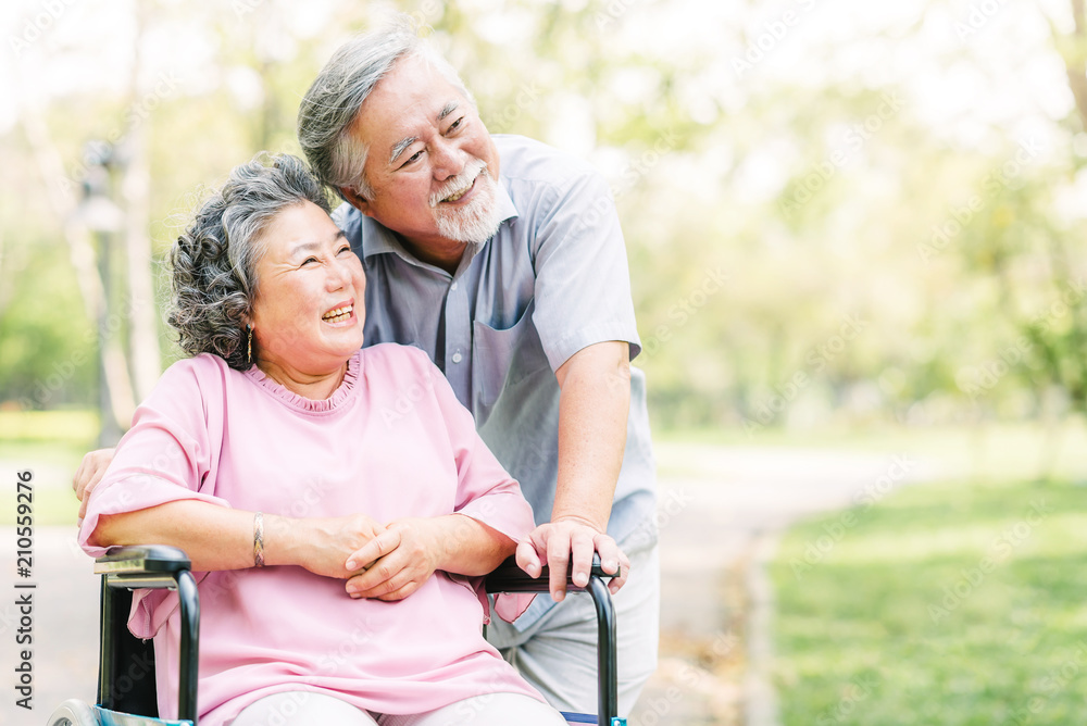 Wall mural happy asian senior couple smiling outside