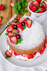 Victoria Sponge Cake with whipped cream and strawberry