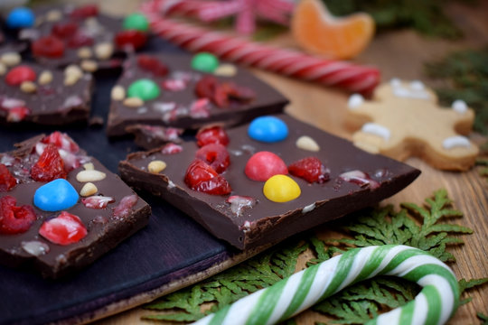 Dark chocolate bark with multicoloured drops, nuts and dried fruits