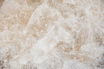 close up of frozen ice and beach sand texture
