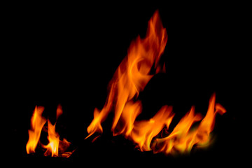 There is a fire in the background.