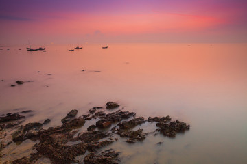 Colorful sky on beautiful beach at sunrise timing located at south of Thailand