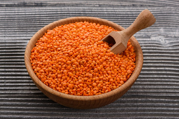 raw lentils on a wooden rustic background