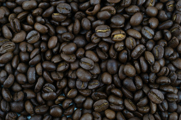 close up,pile of medium or dark roasted coffee beans. can be used as a background or graphic object in your ads.