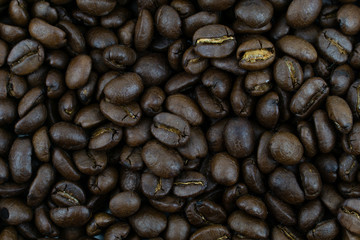 close up,pile of medium or dark roasted coffee beans. can be used as a background or graphic object in your ads.