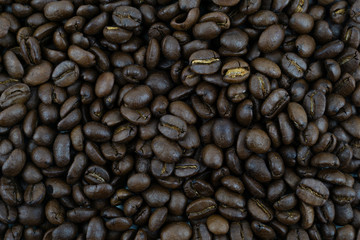 close up,pile of medium or dark roasted coffee beans. can be used as a background or graphic object in your ads.