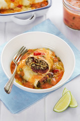 Beef enchiladas with tomato sauce and cheese