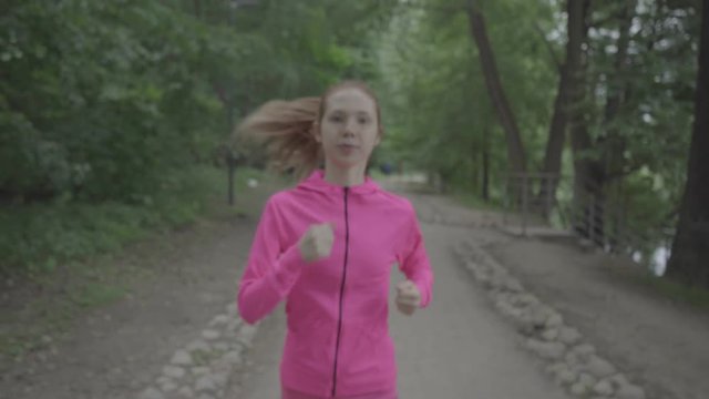 Girl runs through park, color profile Slog3