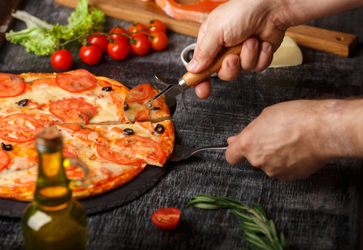 Pizza On The Table Stretching Cheese With Cut Couscous