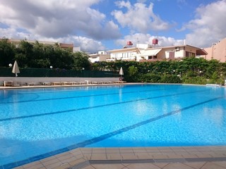 Fototapeta na wymiar Swimming pool in the summer blue sky 