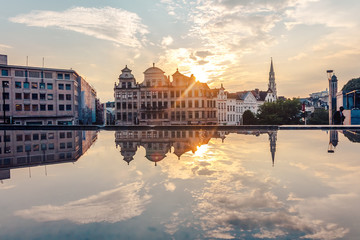 view of the city of Brussels reflected in the water