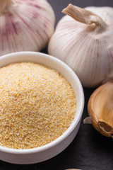 fragrant garlic on a dark stone background