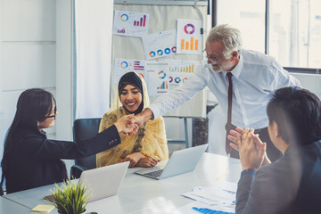 Group of diversity business people makeing handshake for teamwork and agreement concept, at meeting...